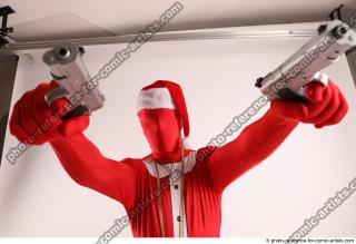 JOEL_ADAMSON CHRISTMAS VILLAIN WITH TWO GUNS